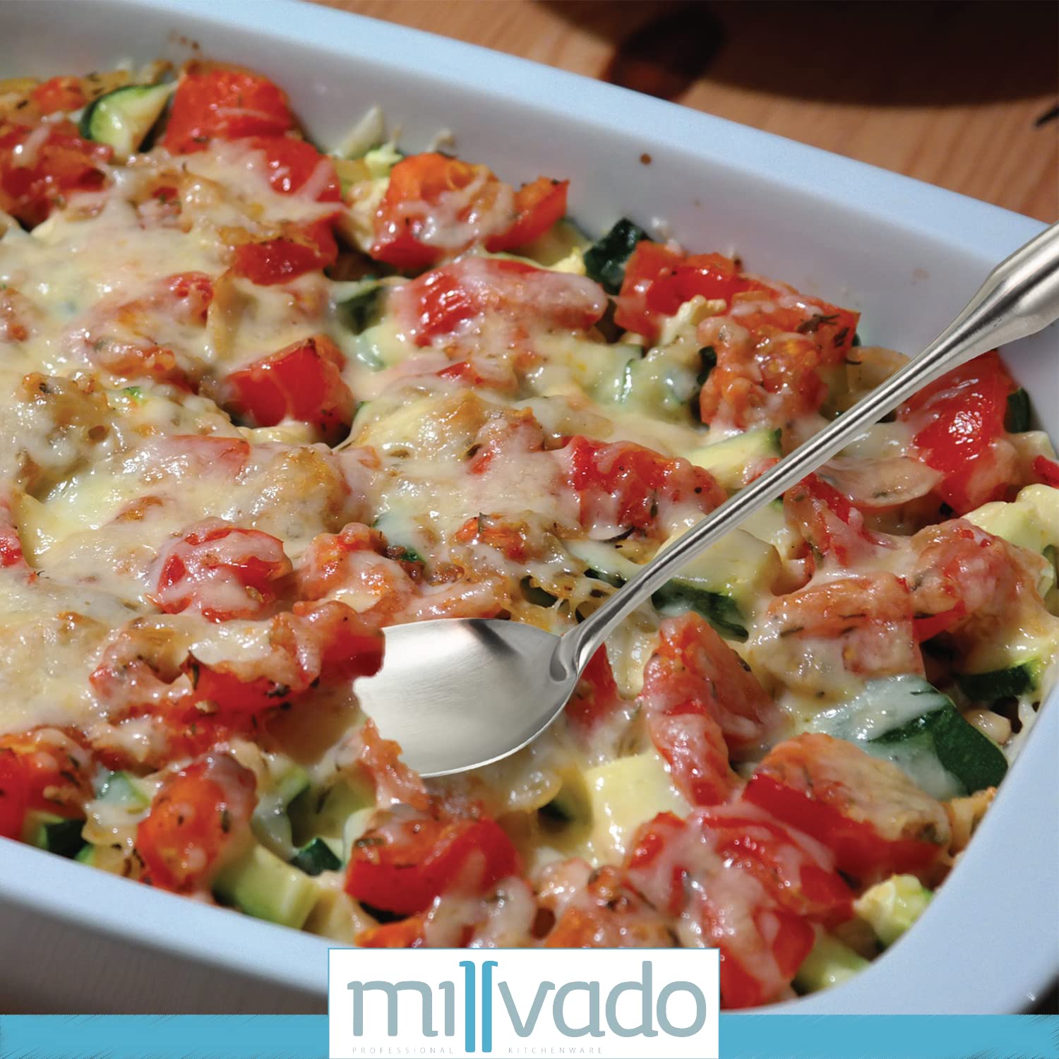 Millvado big spoon serving pasta and vegetables at table