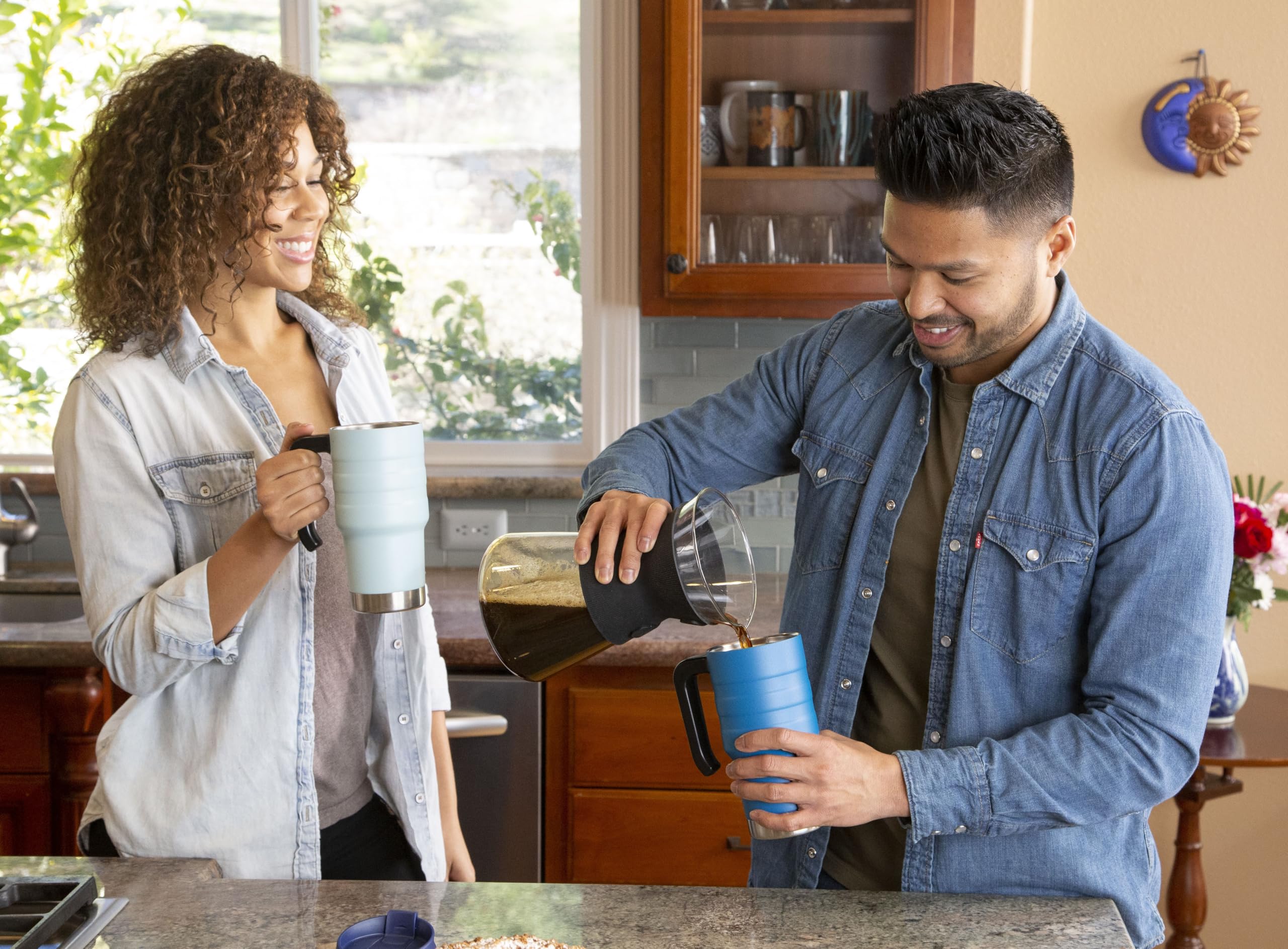 MIRA 18-8 stainless steel travel mug with powder-coated finish for durable grip.