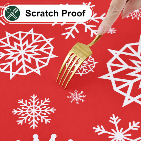Misaya red snowflake 52x70 tablecloth over a holiday dinner setup.