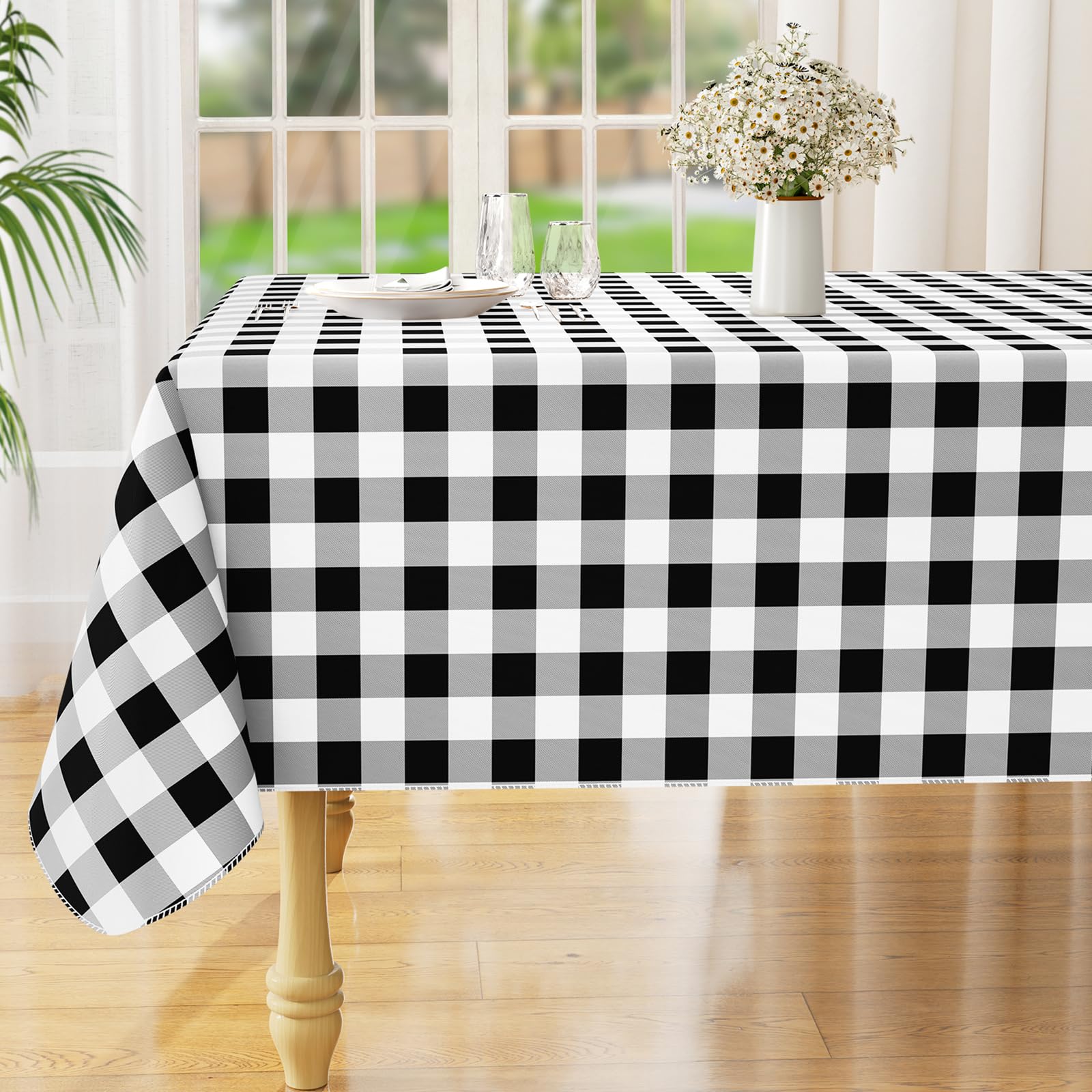 Misaya square waterproof vinyl tablecloth protects surfaces from spills.