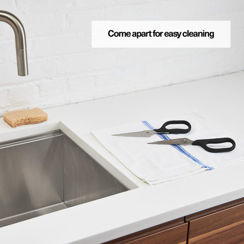 Misen heavy-duty kitchen shears being used to open packages with ease.