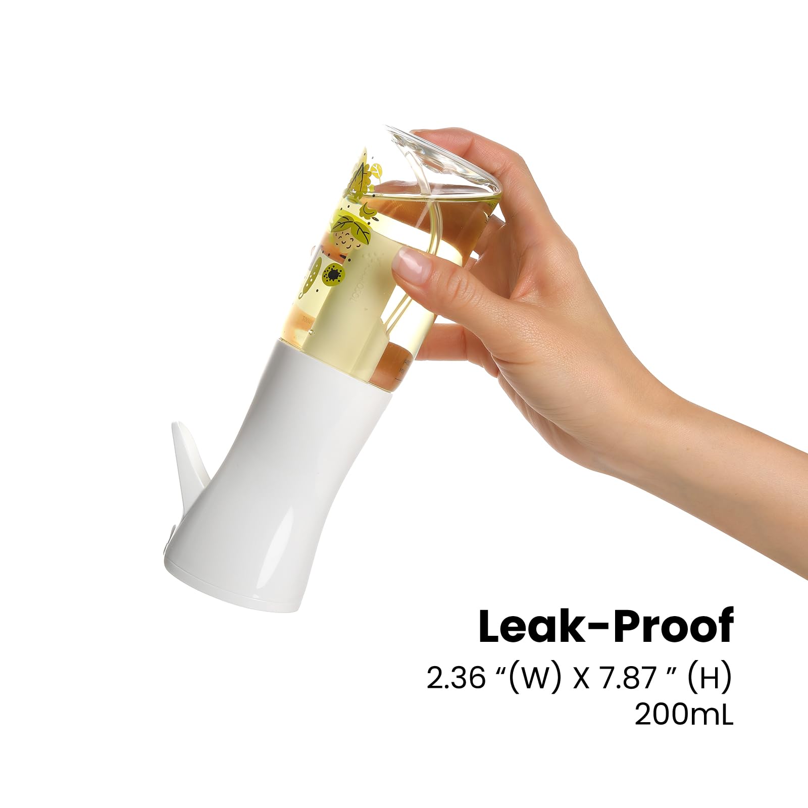 Mistifi Oliver Oil Sprayer in full-stroke mode provides even coverage across a pan.