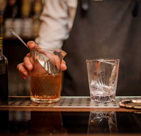 Mixologists glass preserving aromas while diluting for balanced cocktails.