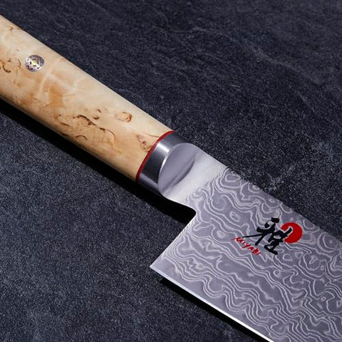 Miyabi Birchwood SG2 Karelian Birch handle close-up emphasizes ergonomic grip.