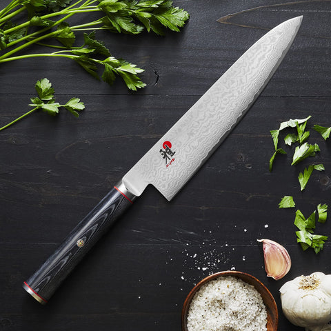 MIYABI Kaizen micarta D-shaped handle offers comfortable grip and moisture resistance.