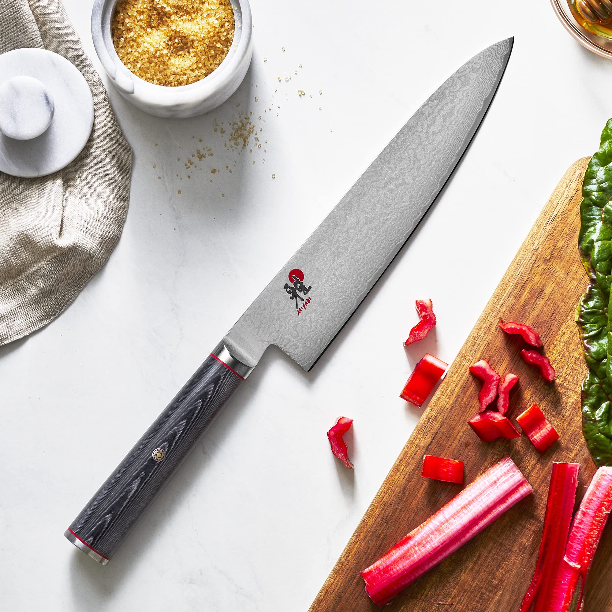 MIYABI Kaizen hand-honed edge via Honbazuke method for precise slicing.