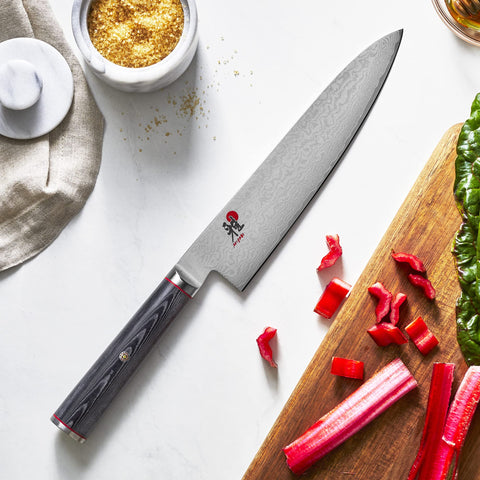 MIYABI Kaizen hand-honed edge via Honbazuke method for precise slicing.