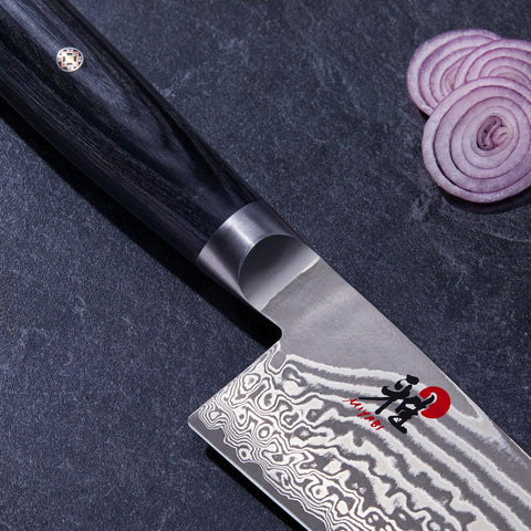 Miyabi Kaizen II thin blade profile enables precise slicing in kitchens.