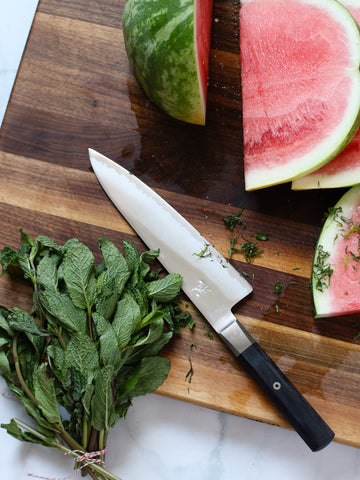 MIYABI Koh 8-inch chef's knife with ergonomic Pakkawood handle for comfortable chopping.