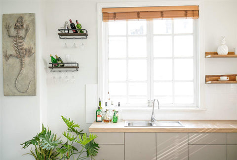 Mkono floating shelves provide space-saving wine and mug storage for compact living spaces.