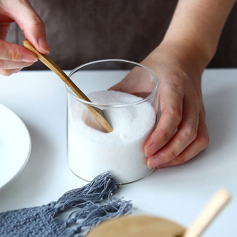 MOLADRI wooden spoon inside jar for easy scooping.