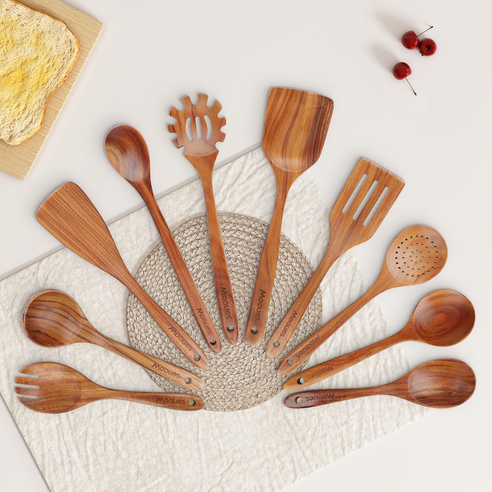 Mooues wooden utensils showing hanging-hole design for neat storage.