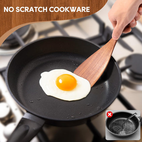 Mooues teak slotted spoon draining liquids while sautéing.