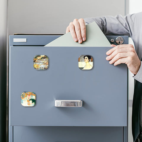 MORCART Klimt magnets holding photos and kids' art on a fridge