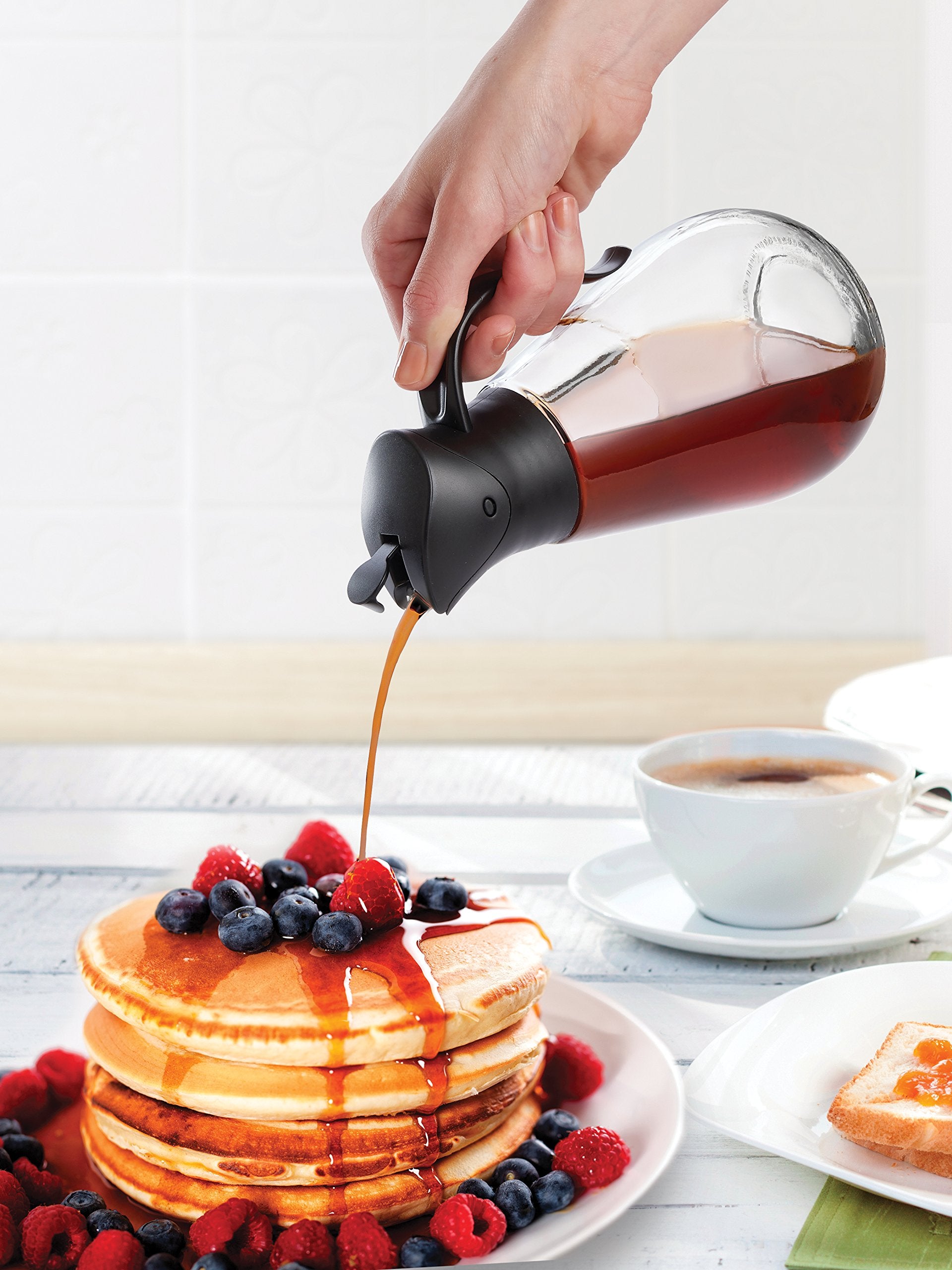 Mrs. Anderson's Store'N Pour dispenser auto-closes lid for mess-free storage after pouring.