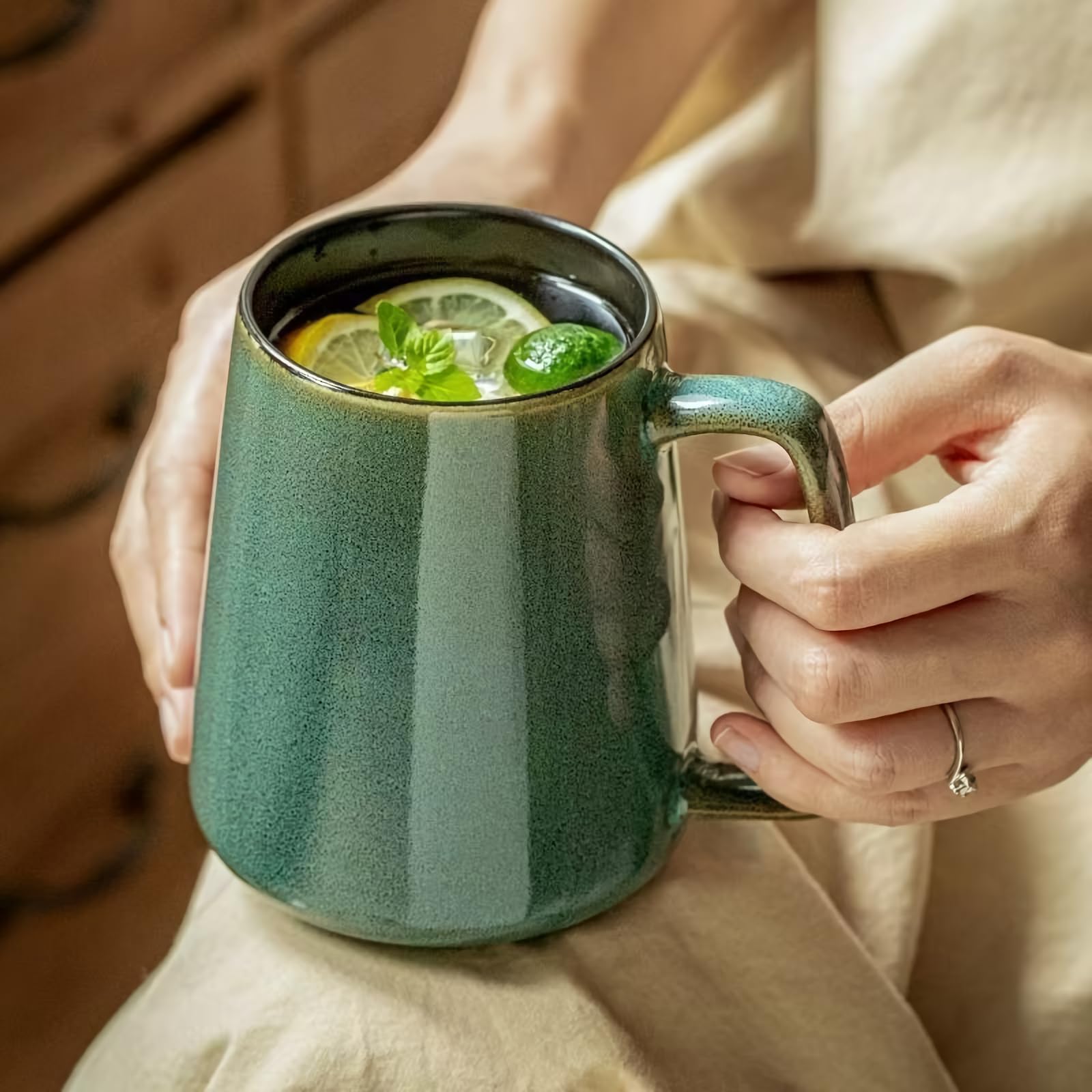 Mualuwi 24oz mug on table in blue-green pair.