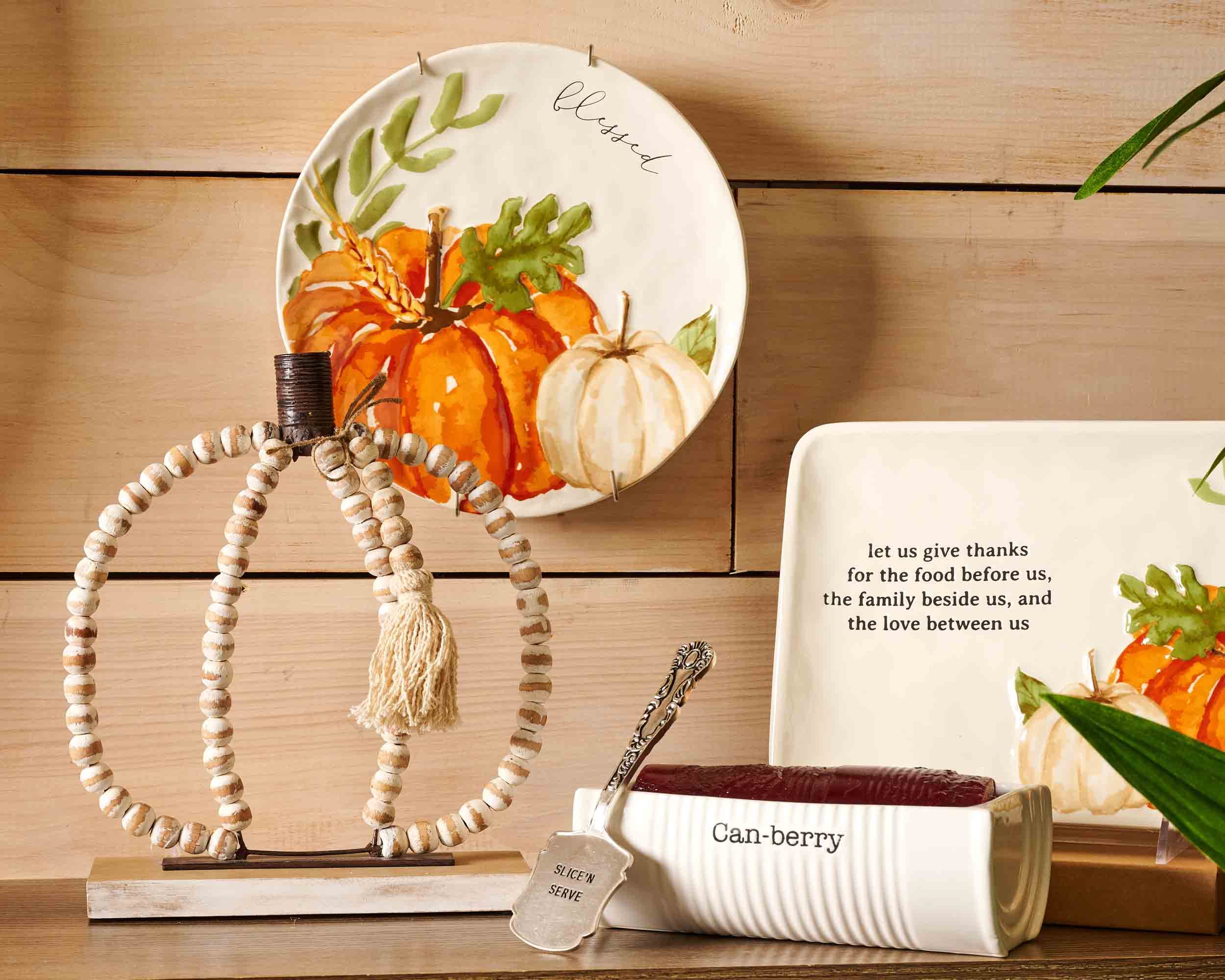 Mud Pie cranberry-themed table setting enhances seasonal table styling.