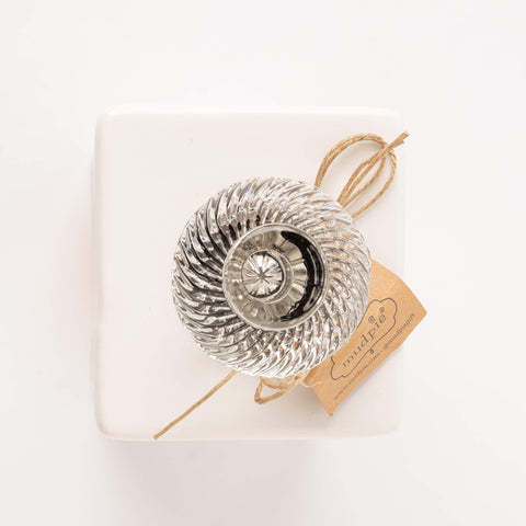 Mud Pie tea bag caddy placed on a kitchen counter