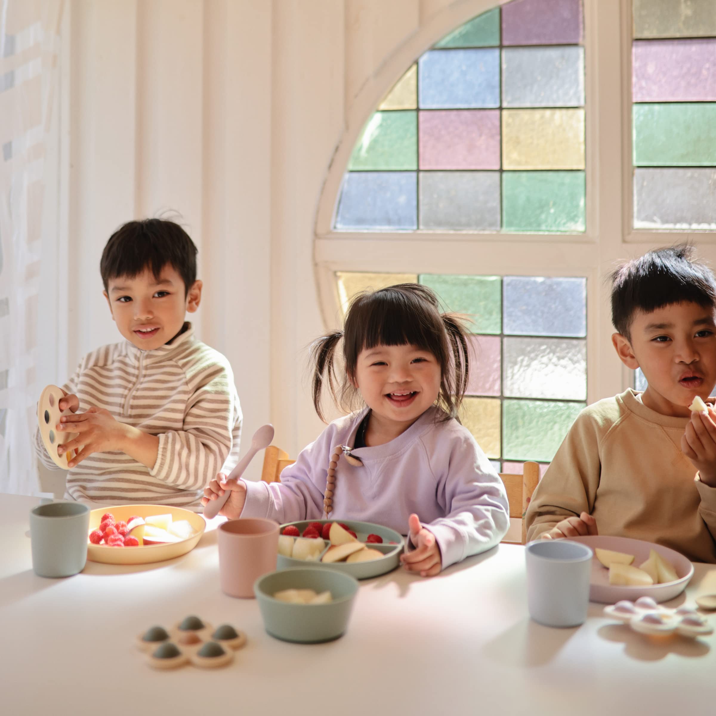 Mushie blush square plate used at lunch, ideal for child-sized portions.