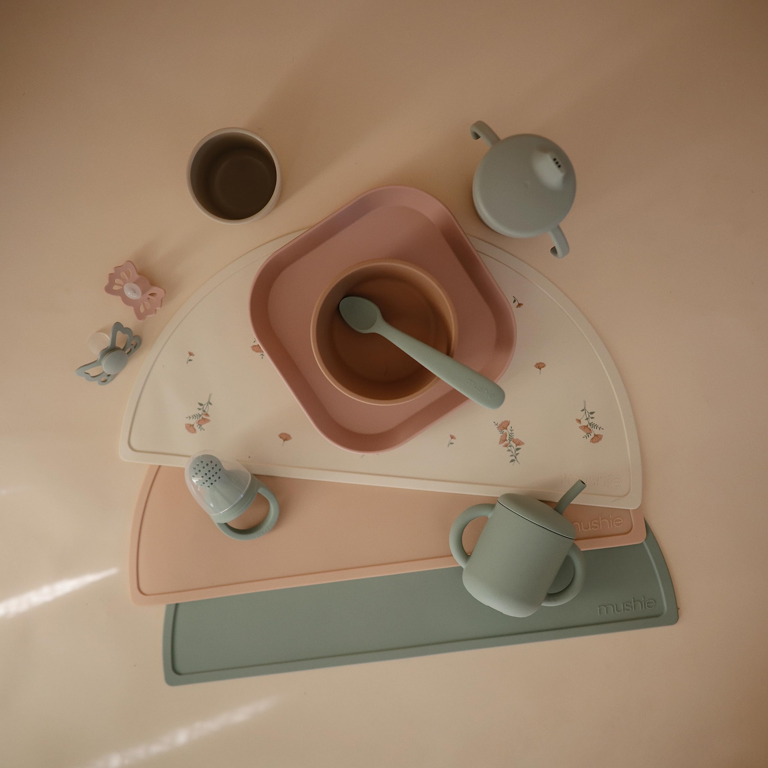 Dishwasher-safe Mushie plates on the top rack, quick cleanup.