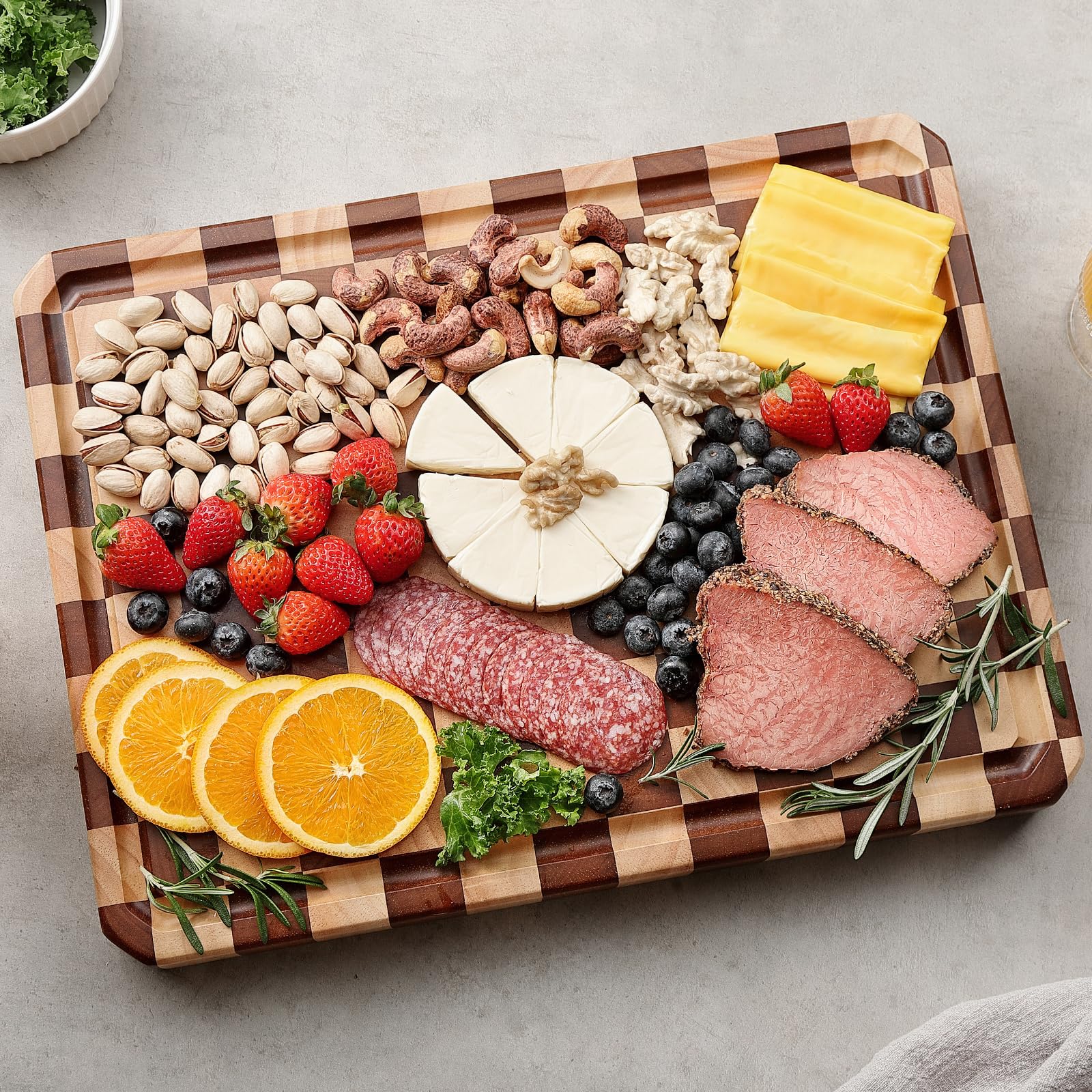 Musifan Acacia cutting board with juice tank helps keep prep areas tidy.