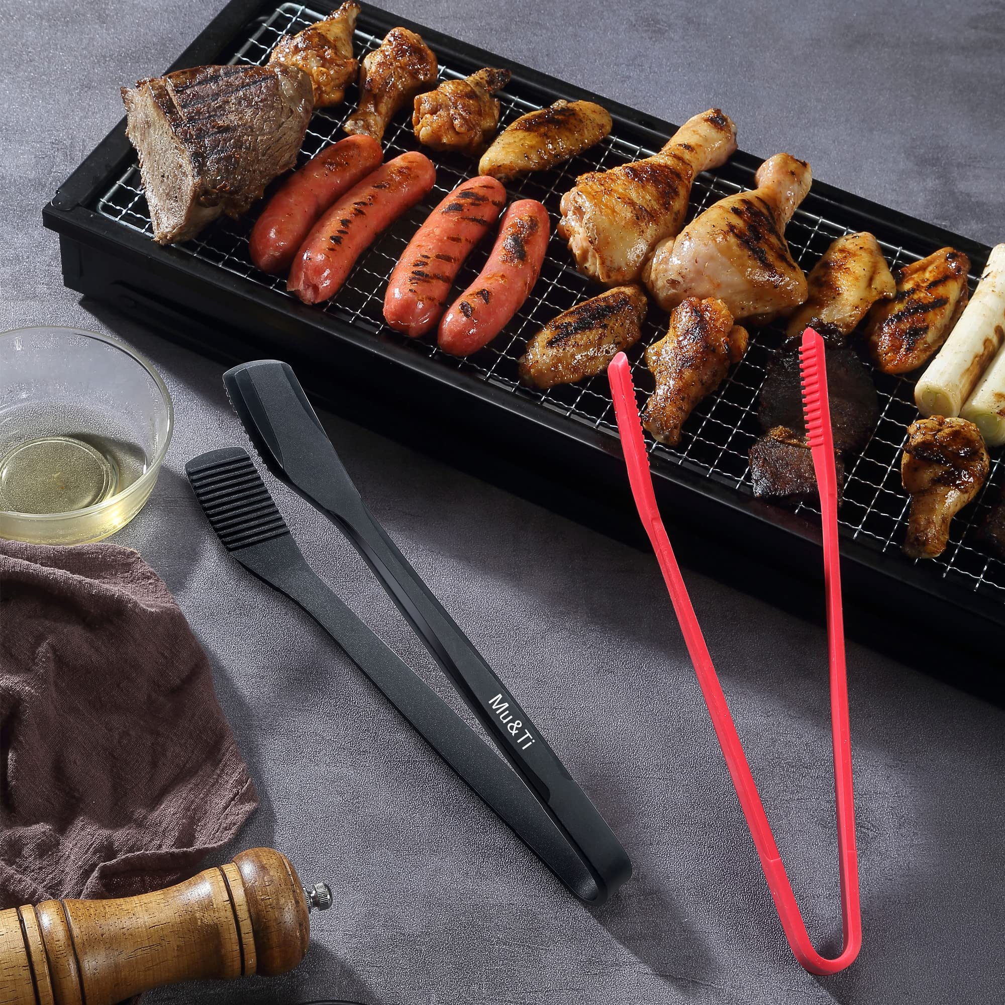 Mu&Ti tongs on grill illustrating versatile use