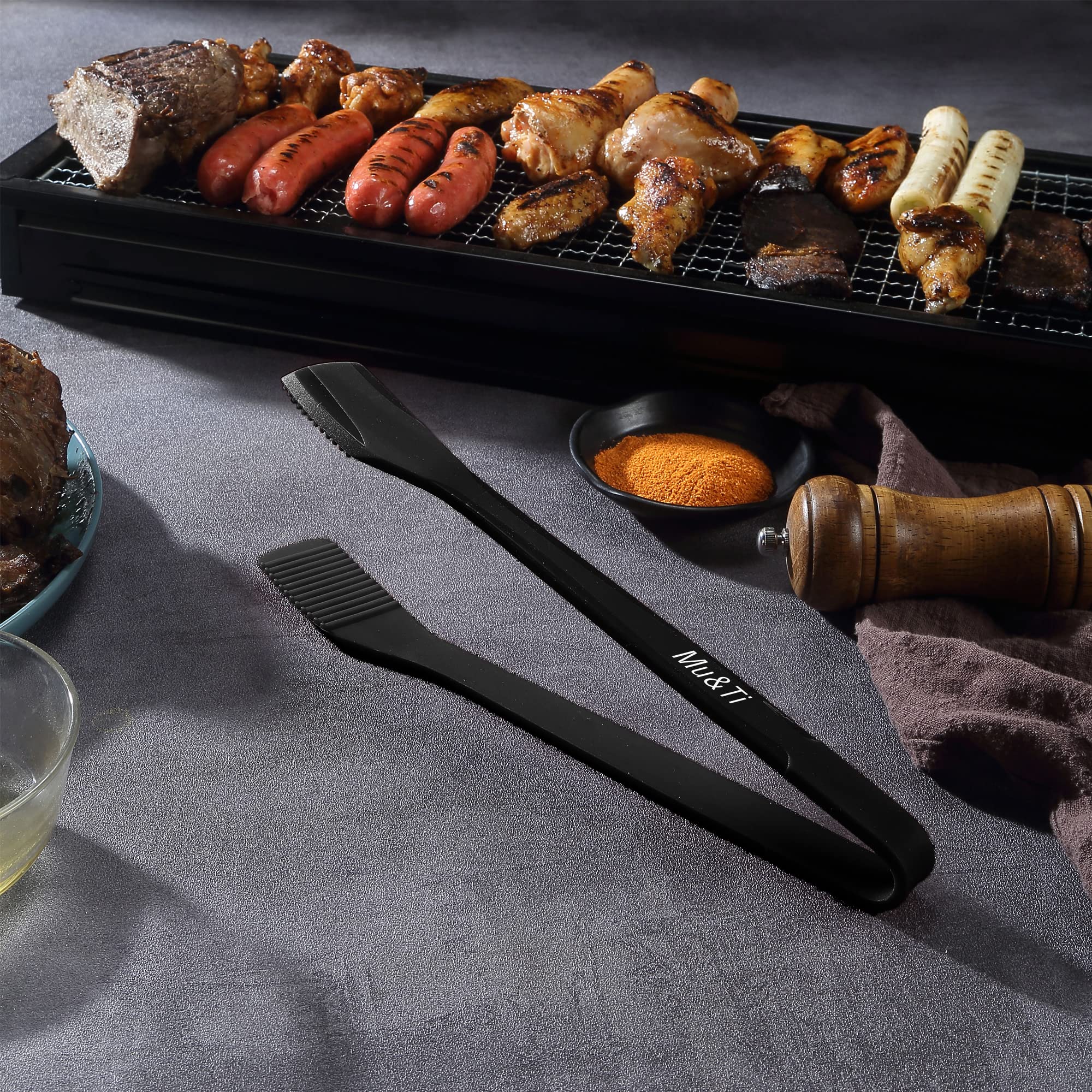 Mu&Ti tongs serving salads and flipping foods at the table