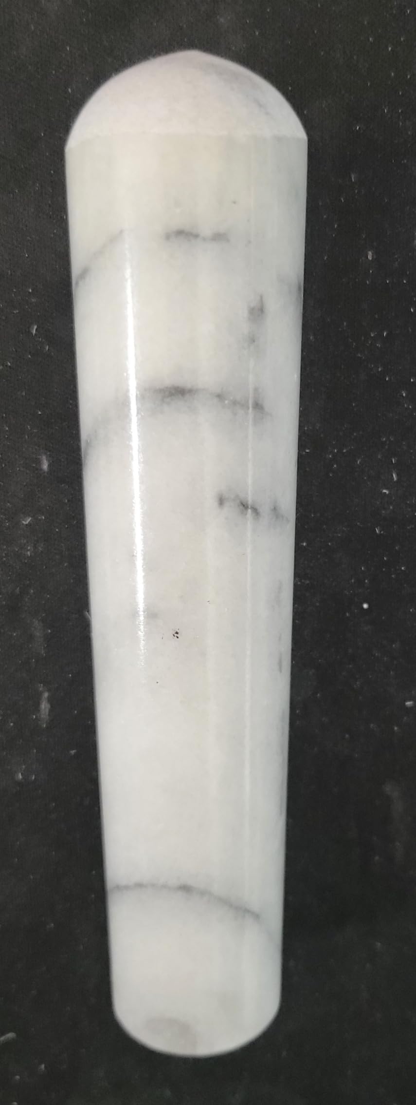 Close-up of smooth marble texture ready for fine grinding of seeds.