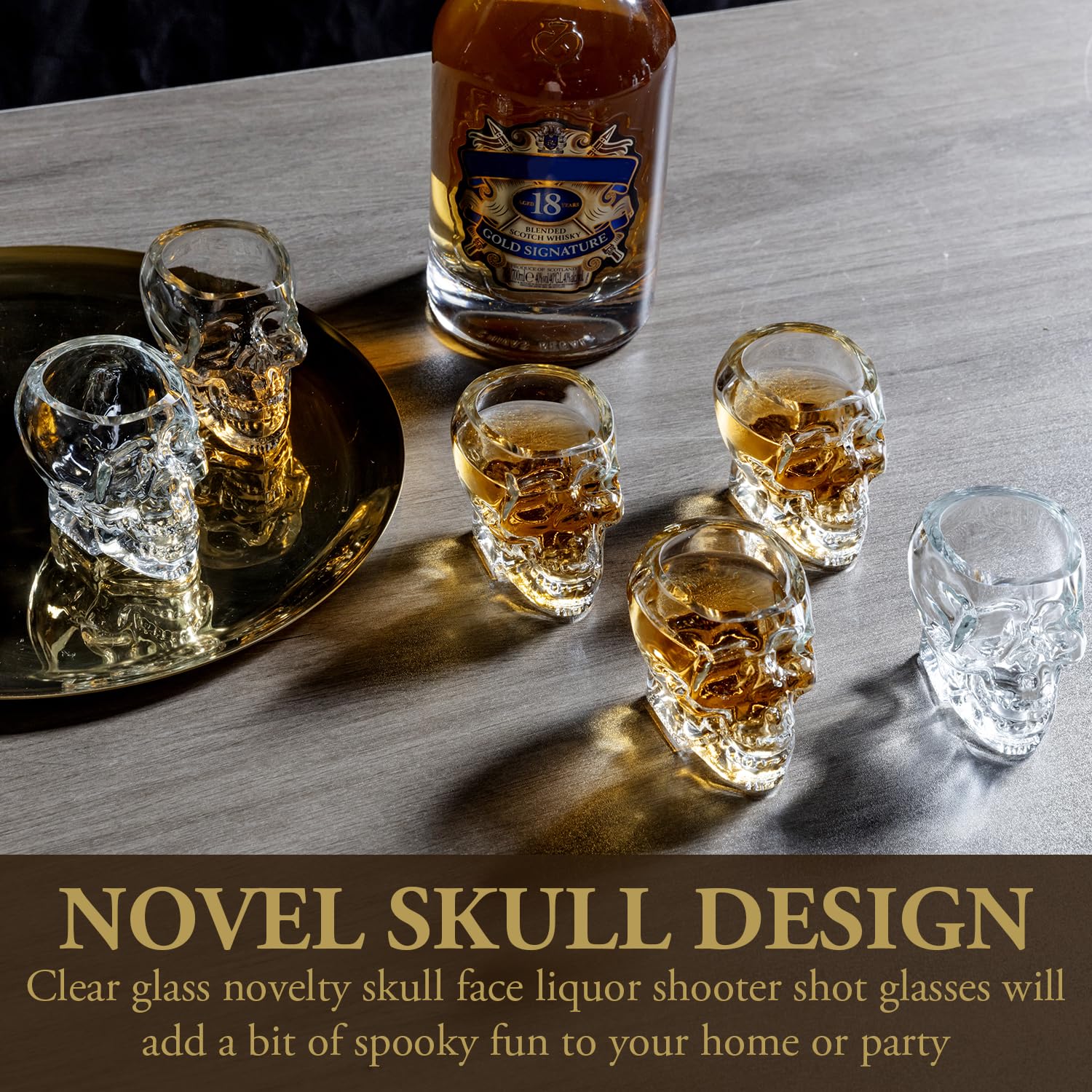 MyGift skull shot glasses stacked neatly on a shelf beside candles.