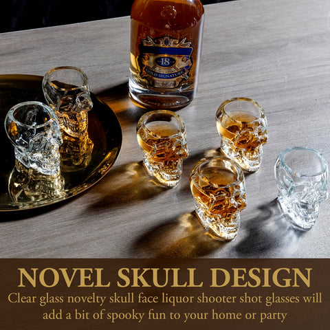 MyGift skull shot glasses stacked neatly on a shelf beside candles.