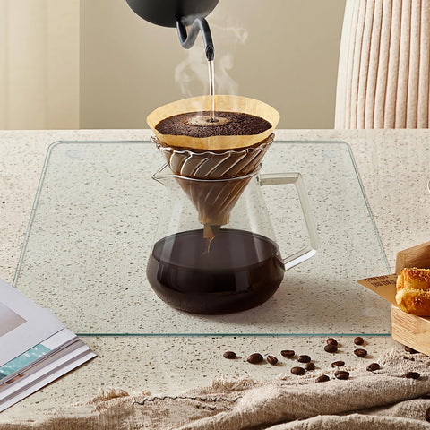 Mymonfif glass board on countertop demonstrating heat resistance.