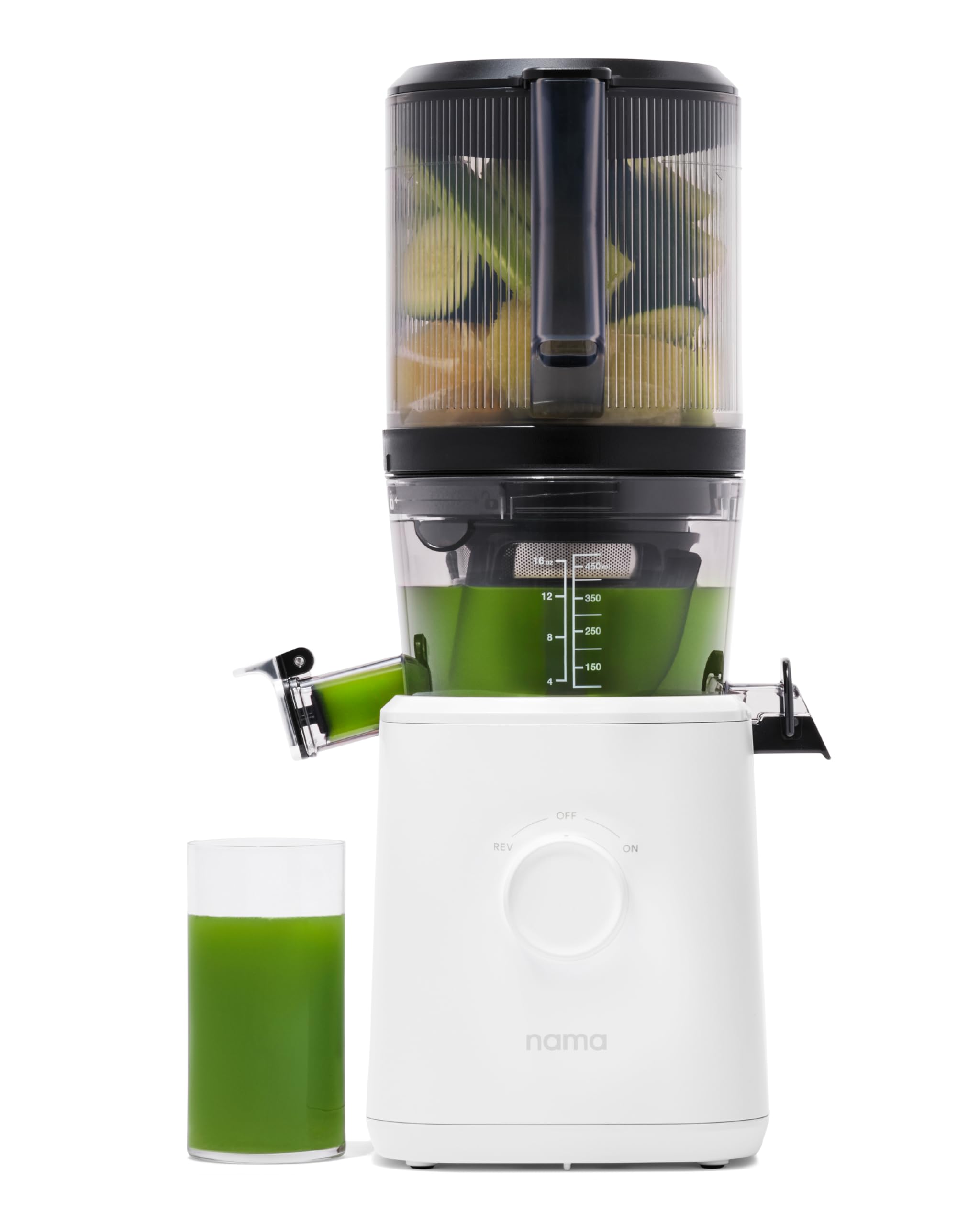 Nama J2 self-feeding hopper loading ingredients for quick, hands-free juicing.