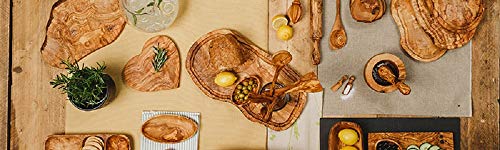 Naturally Med olive wood cutting board close-up grain highlighting rich natural patterns.