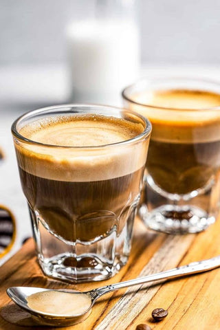 Necessia cortado glasses clarity closeup highlighting crystal-clear glass and crema.