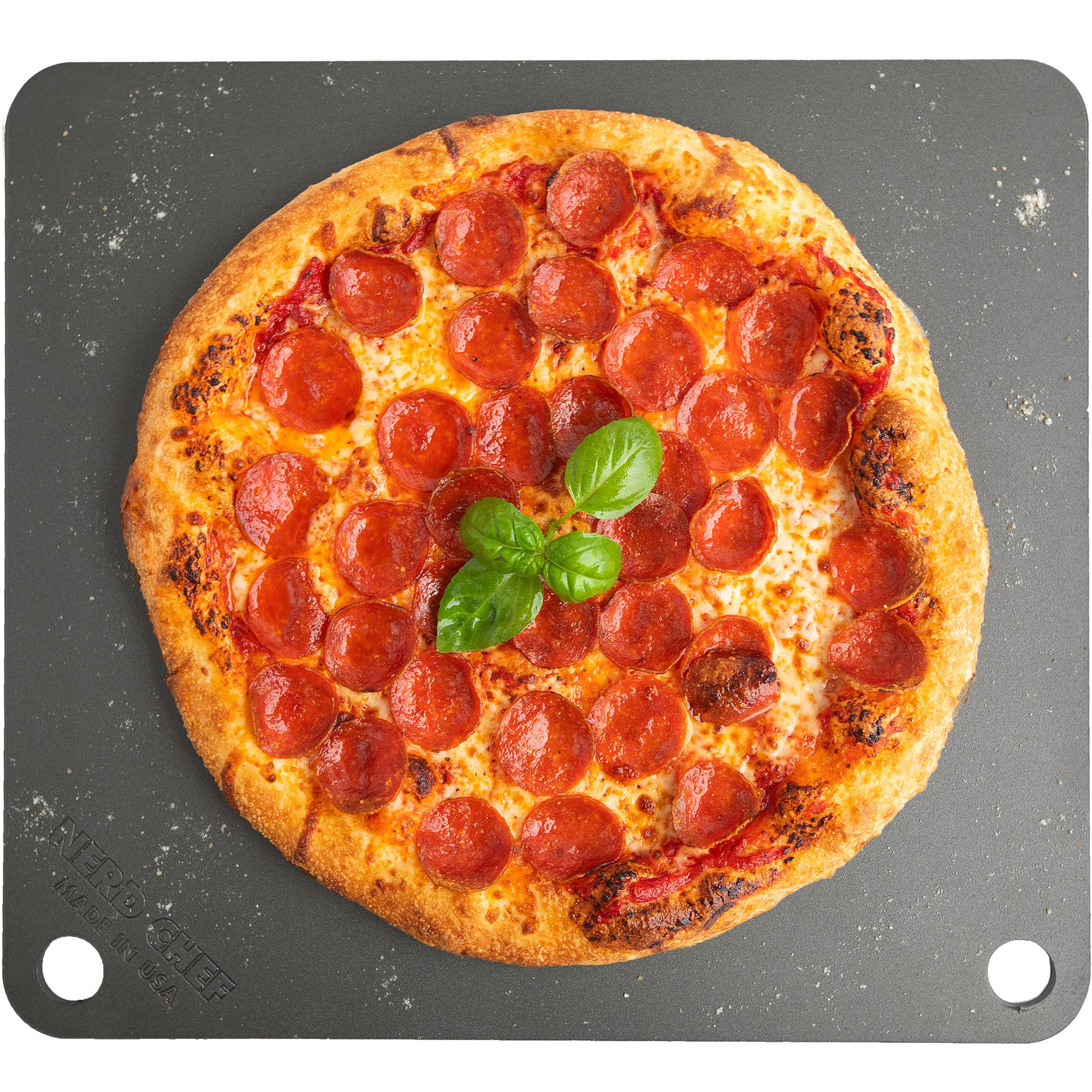 NerdChef Steel Stone pizza crust closeup shows blistered edges for restaurant-quality texture.