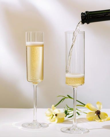 Nervure 6oz clear plastic champagne flutes add a stylish touch to weddings.
