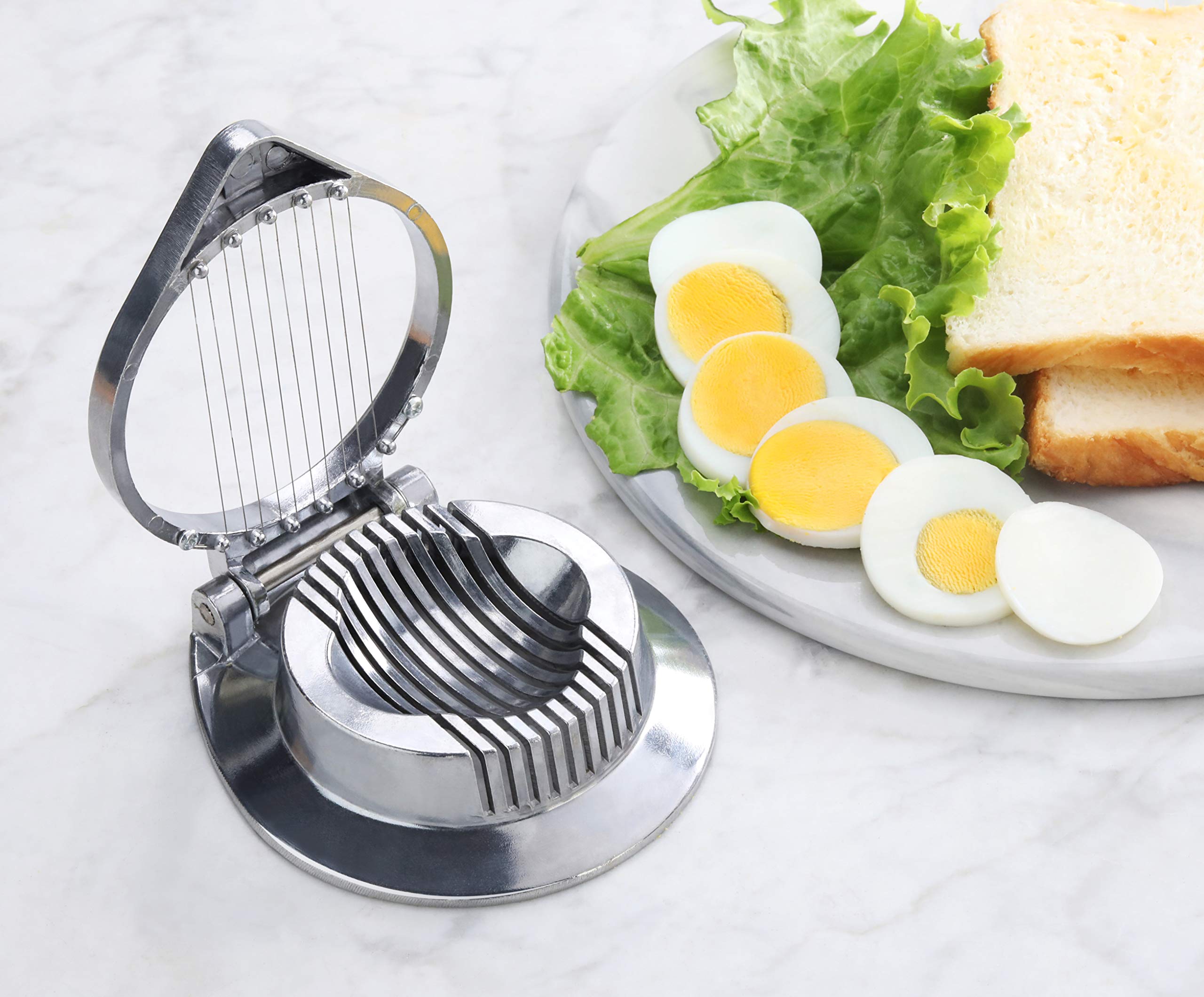 New Star Foodservice 36459 compact slicer measures 4.5 by 4.25 inches on the counter.