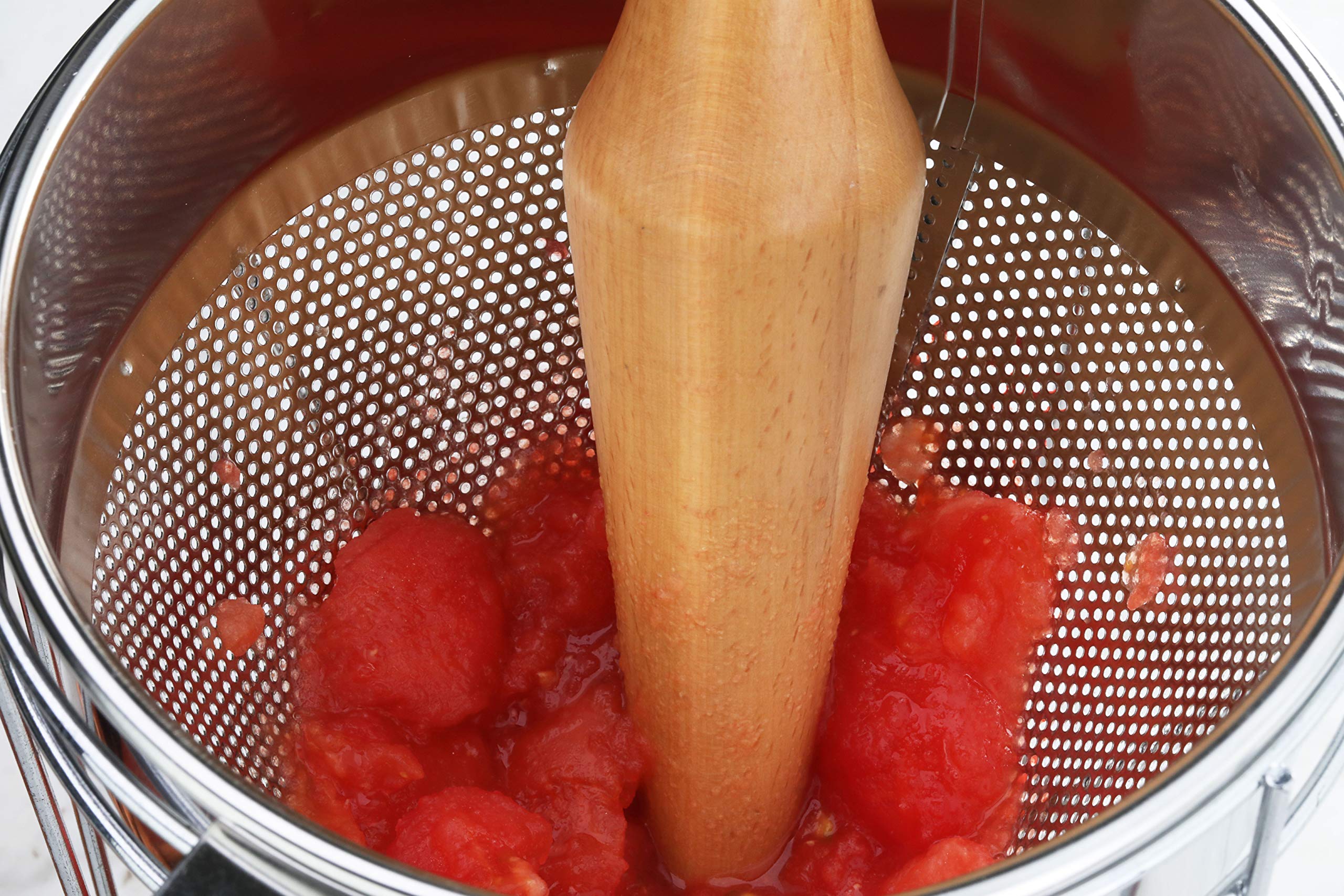 New Star Foodservice 42566 strainer rests in a pot for easy use.
