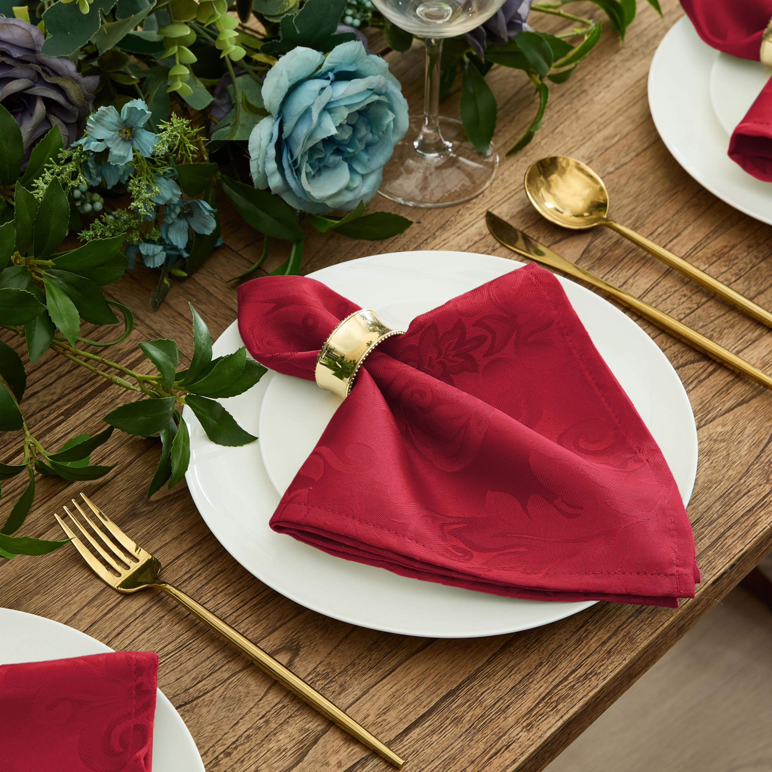 Newbridge Barcelona Damask red tablecloth sets warm mood in dining spaces.