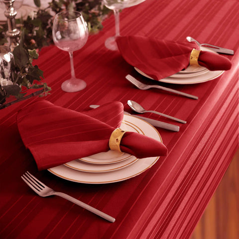 Elegant holiday setting featuring Newbridge red tablecloth and decor