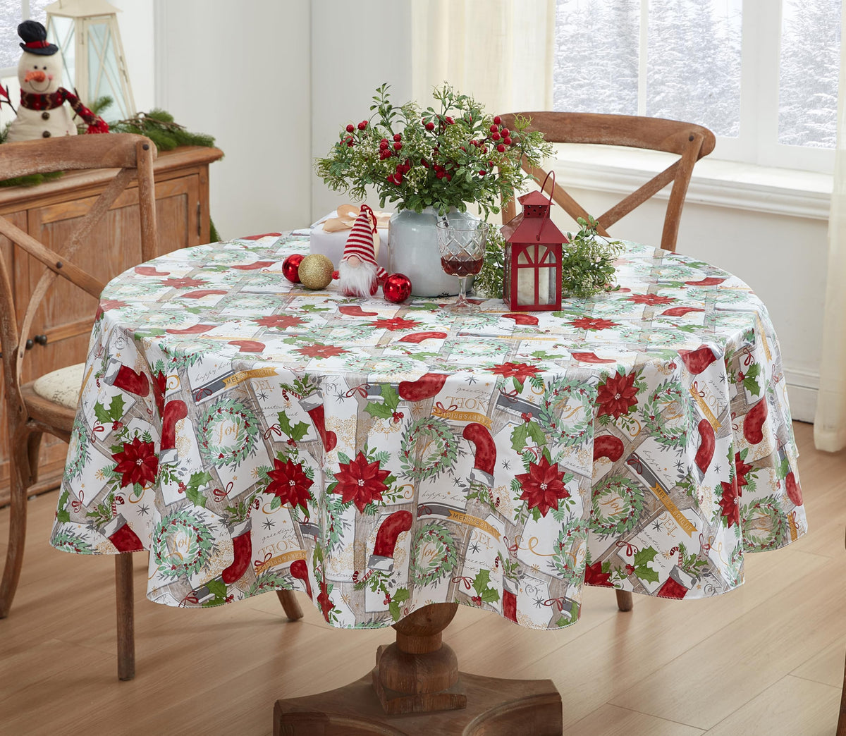 Newbridge Merry Christmas tablecloth with wreaths and poinsettias enhances holiday table settings.
