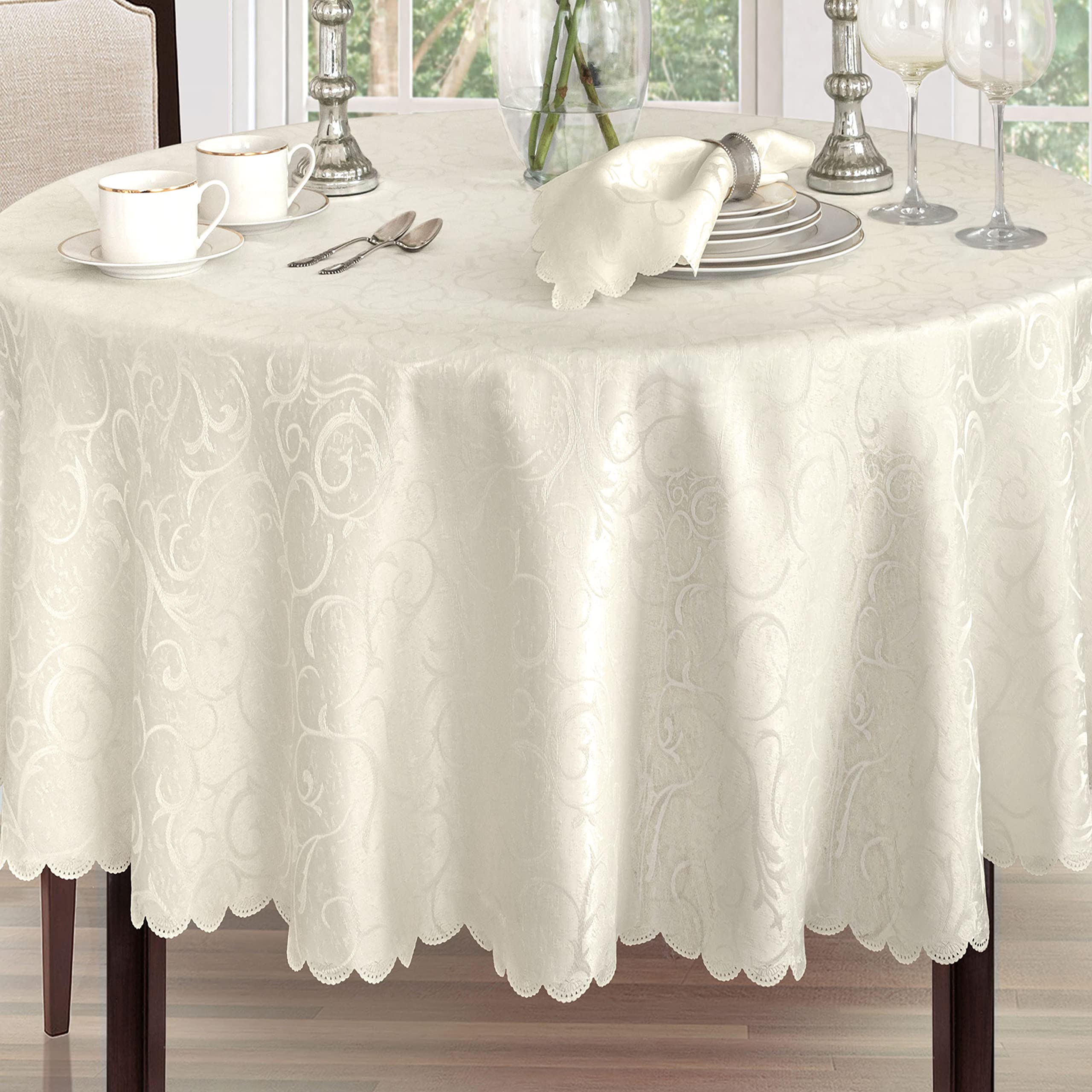 Ivory round Newbridge Portofino table setting creating a sophisticated dining backdrop.