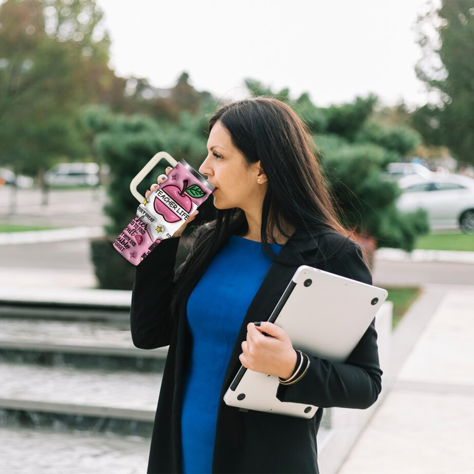 NIAXAUYT pink tumbler in a classroom setting with a teacher-ready vibe.