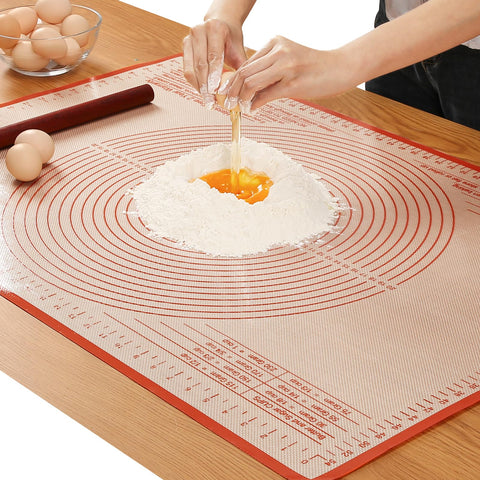 Close-up of dough rolling with measurement marks for precise, even pastry sheets.