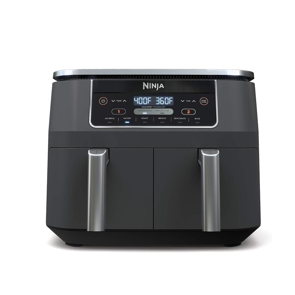 Ninja DZ201 dual-zone baskets show two independent compartments for two foods at once.