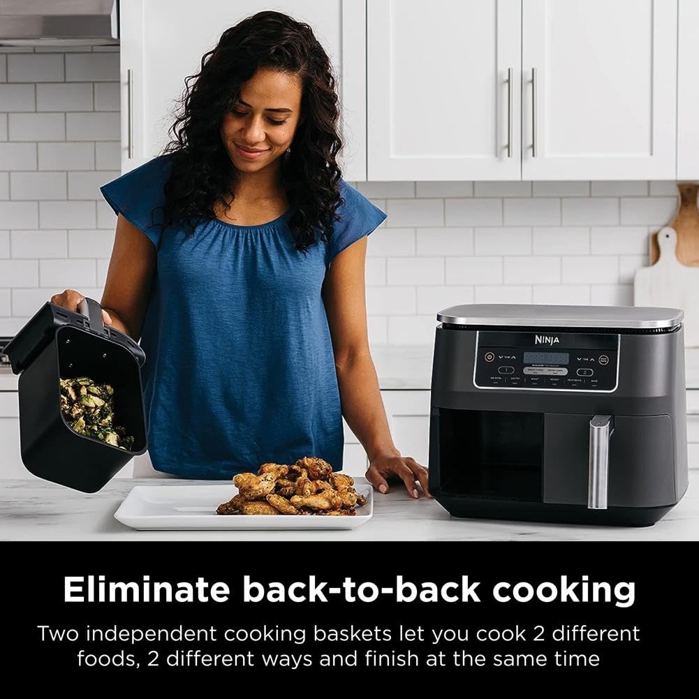 Ninja DZ201 two foods at once feature demonstrated by separate baskets cooking different items.