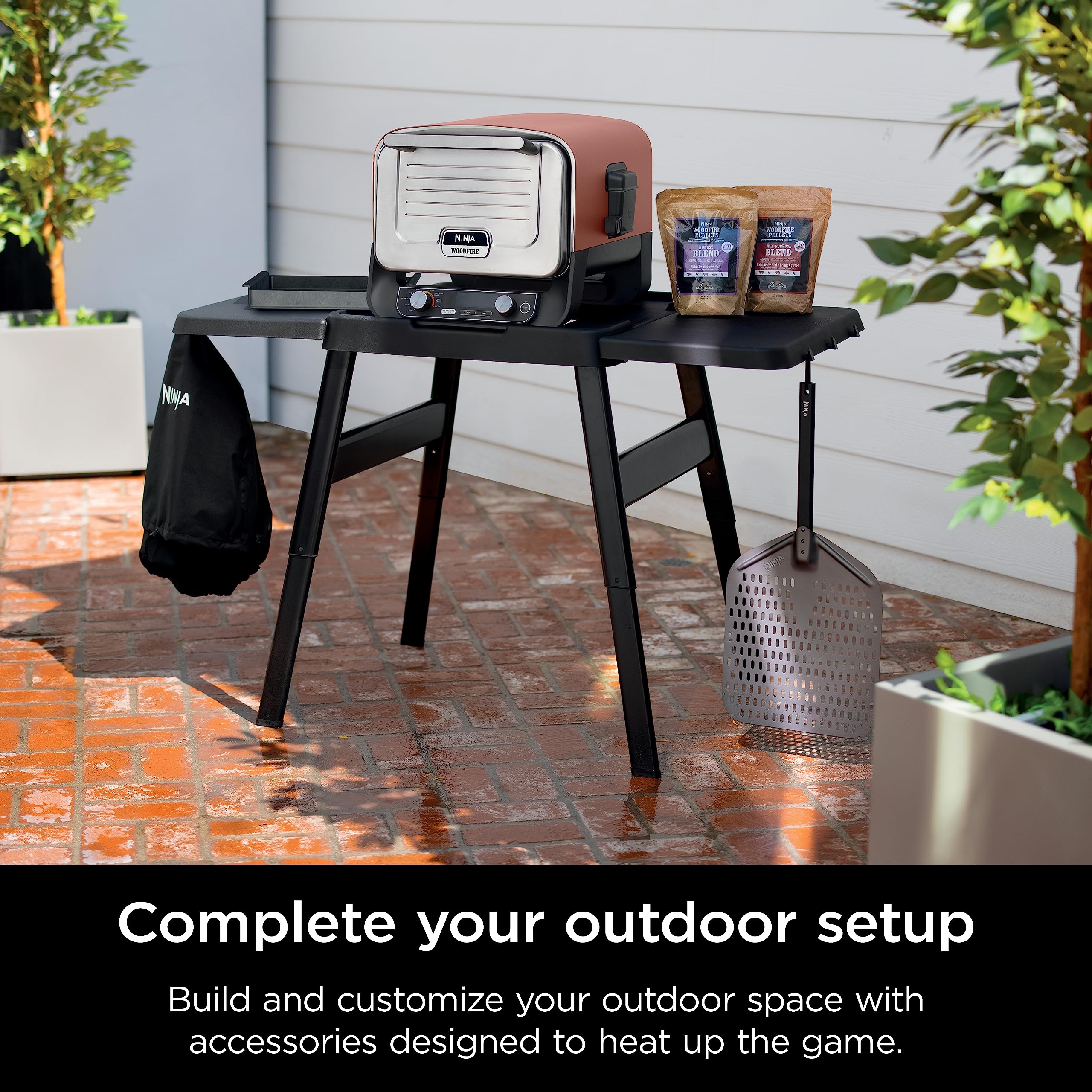 Ninja XSKOPPL woodfire perforated aluminum peel resists rust outdoors.