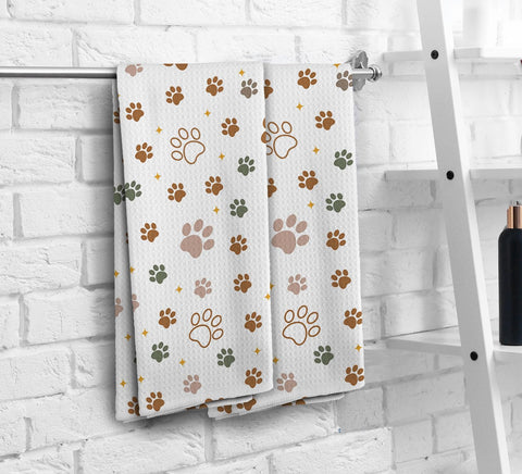 NOQL Dog Paws dishcloth set folded together for stylish kitchen decor