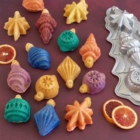 Nordic Ware six-cakelet layout enables precise filling for decorative treats.