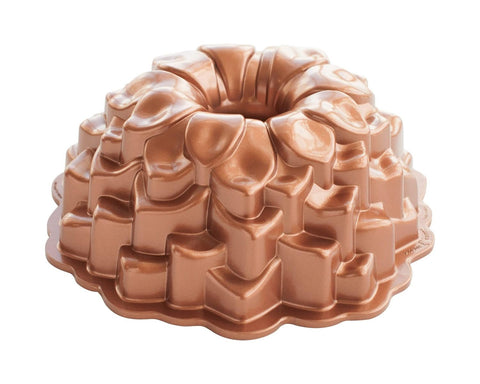 Nordic Ware Blossom Bundt Pan close-up highlights intricate petal details for stunning desserts.